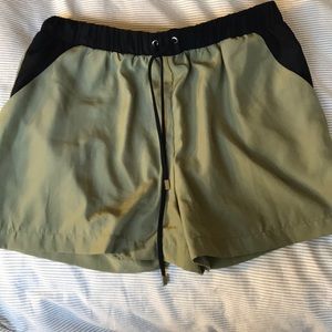 Silky green shorts with elastic waistband